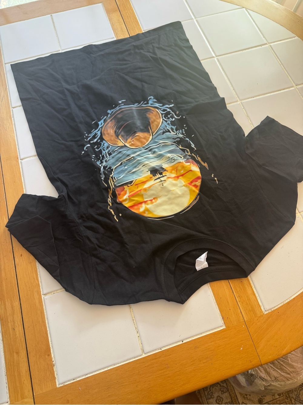 Men's Black Graphic Tee with Surf Sunset Circle Design